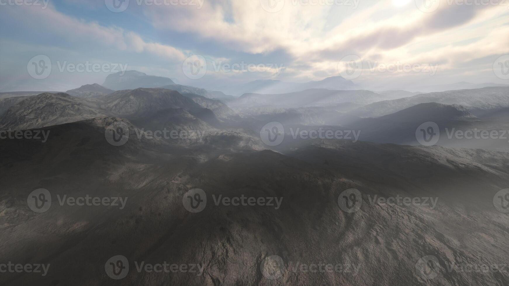 majestic mountain range under a dramatic cloudy sky photo