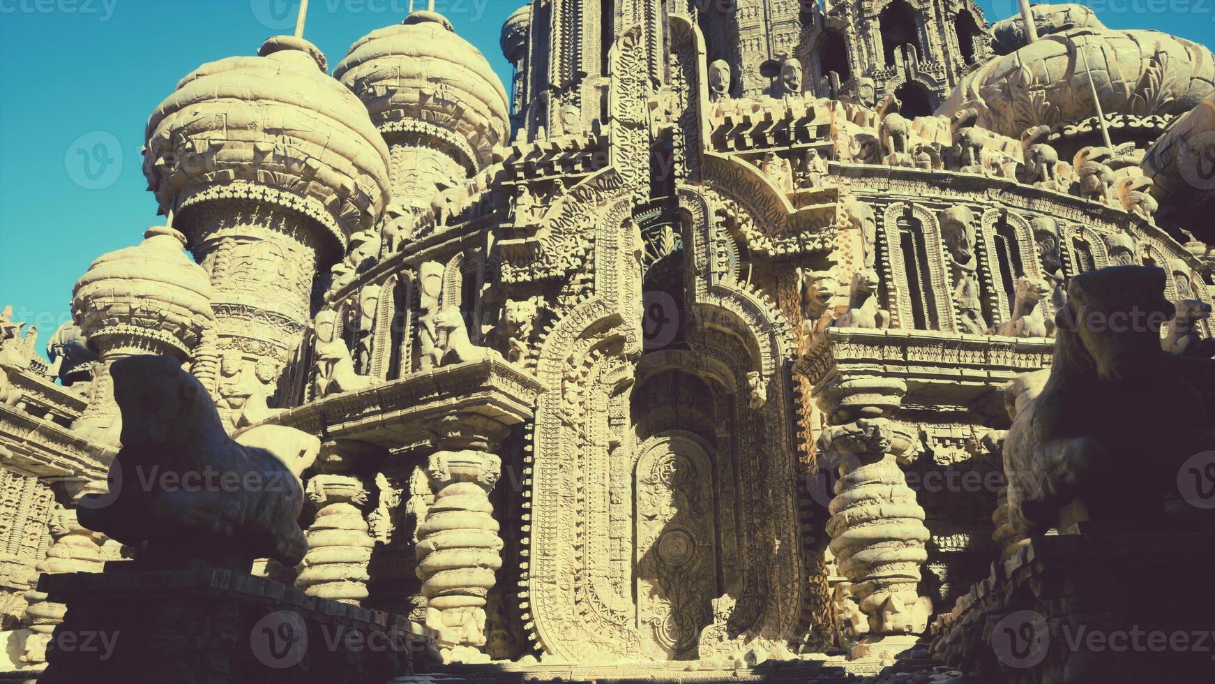 A towering building adorned with an intricate clock on its side photo