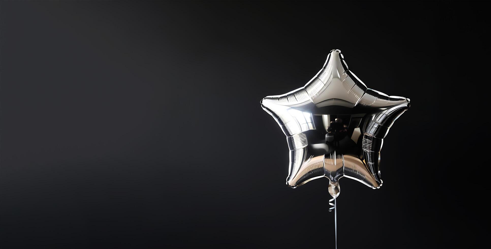ilver shiny star balloon on black background with copy space photo