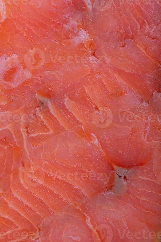 Red salmon fish as background macro photo. photo