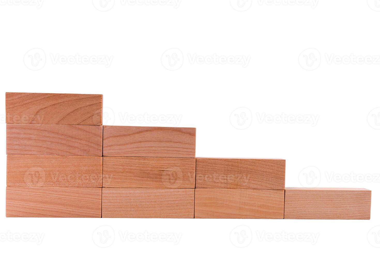 Wooden cubes stacked to form steps of a staircase. White background photo