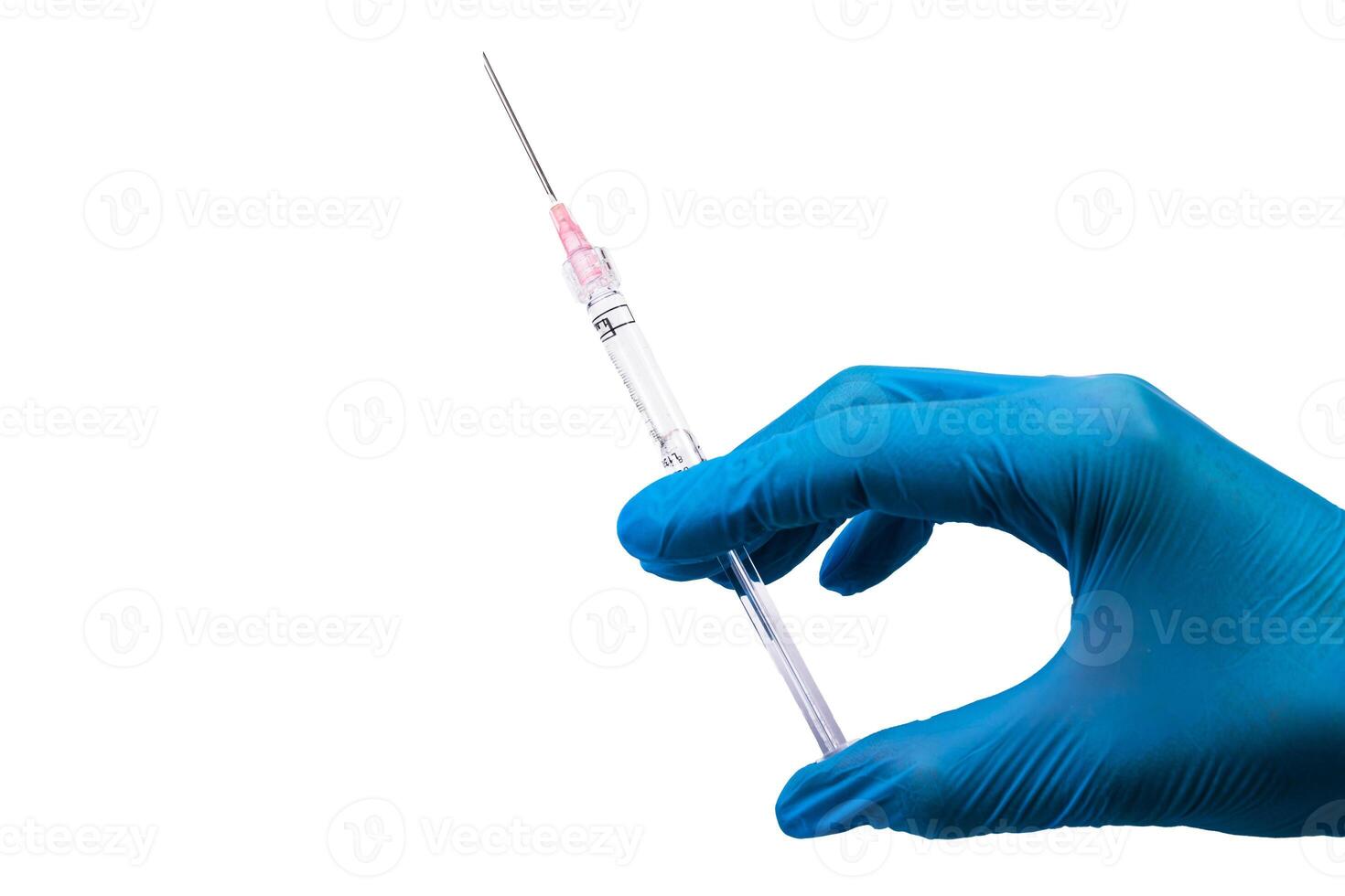 Medical syringe with injection in doctor's hand in blue glove on white background. Vaccination photo