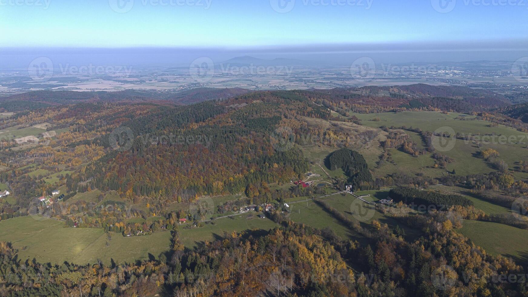 Mountains covered with colorful autumn trees, autumn mountain aerial landscape. Drone view photo