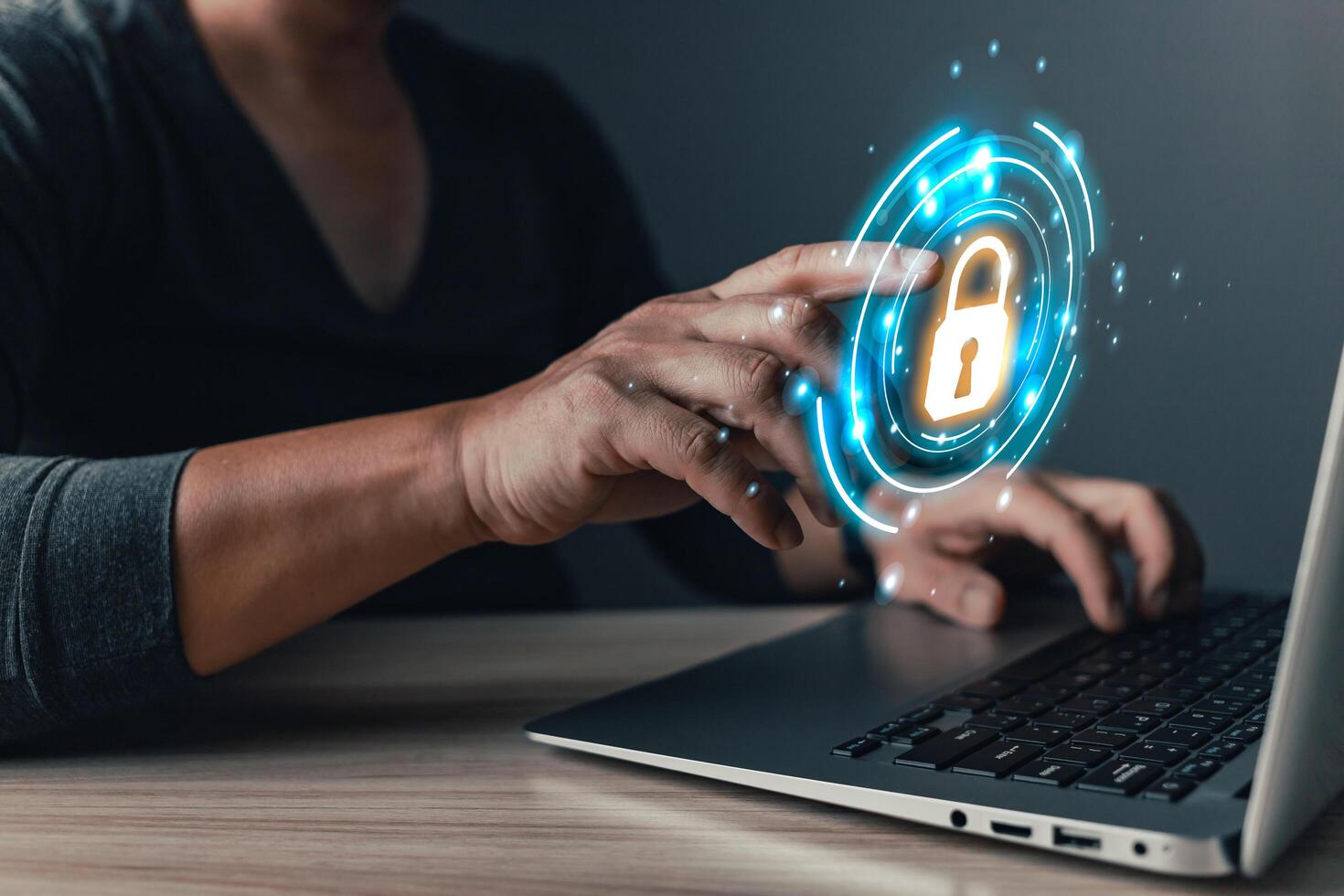 Cybersecurity and privacy protection network security computer and safe data concept. Businessmen protect personal data information from viruses on a laptop with virtual screen interfaces. photo