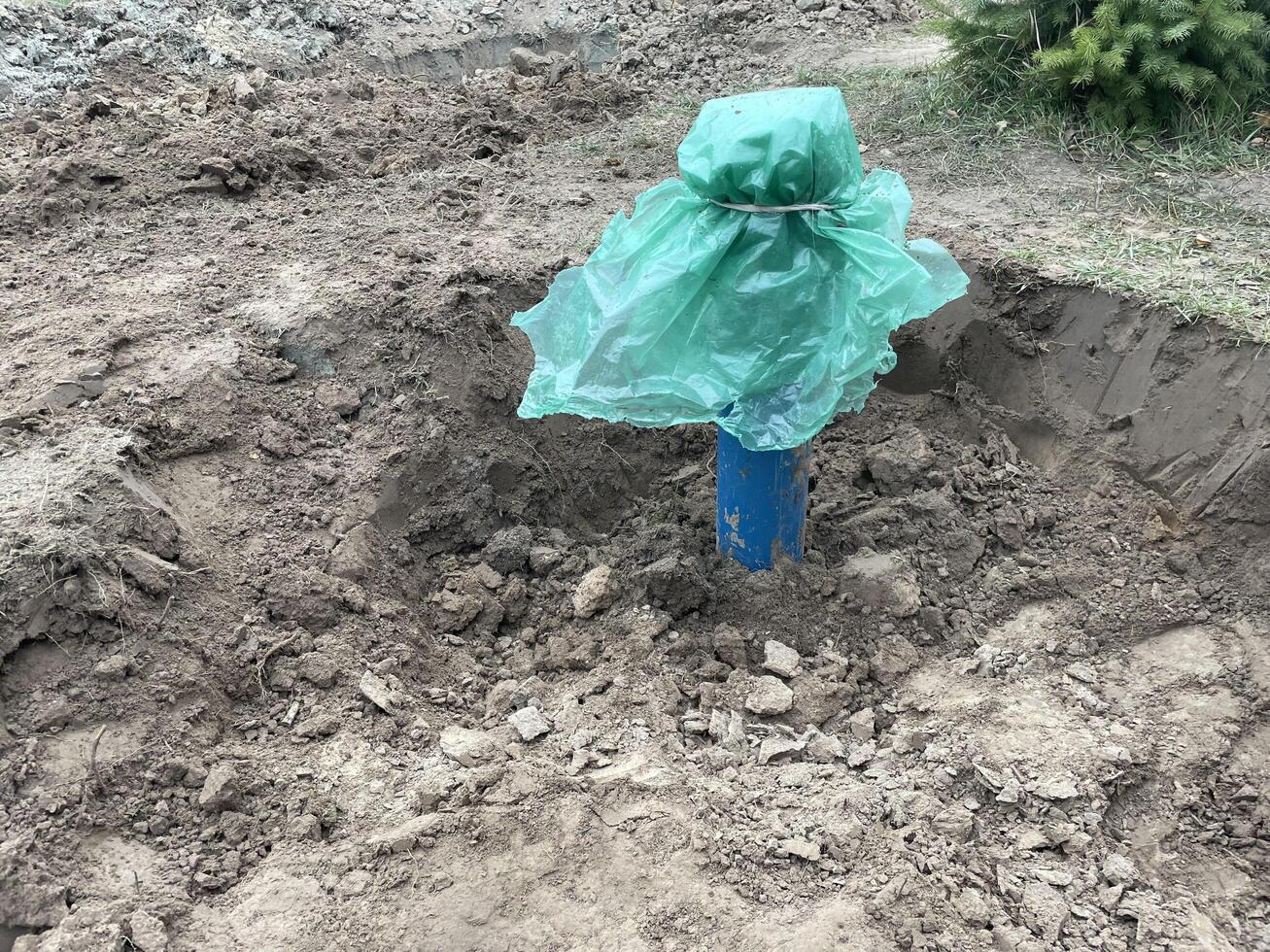Construction team digging a fresh water well photo