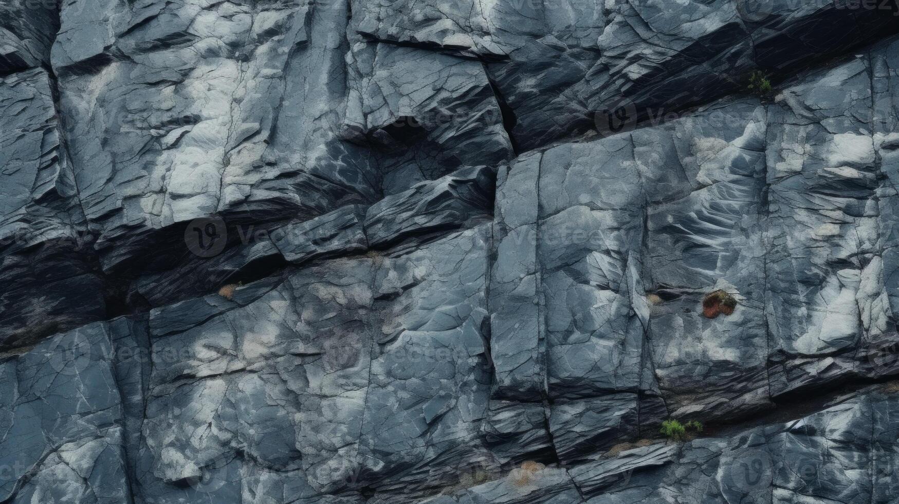 Dark aged shabby cliff face and divided by huge cracks and layers. Neural network photo