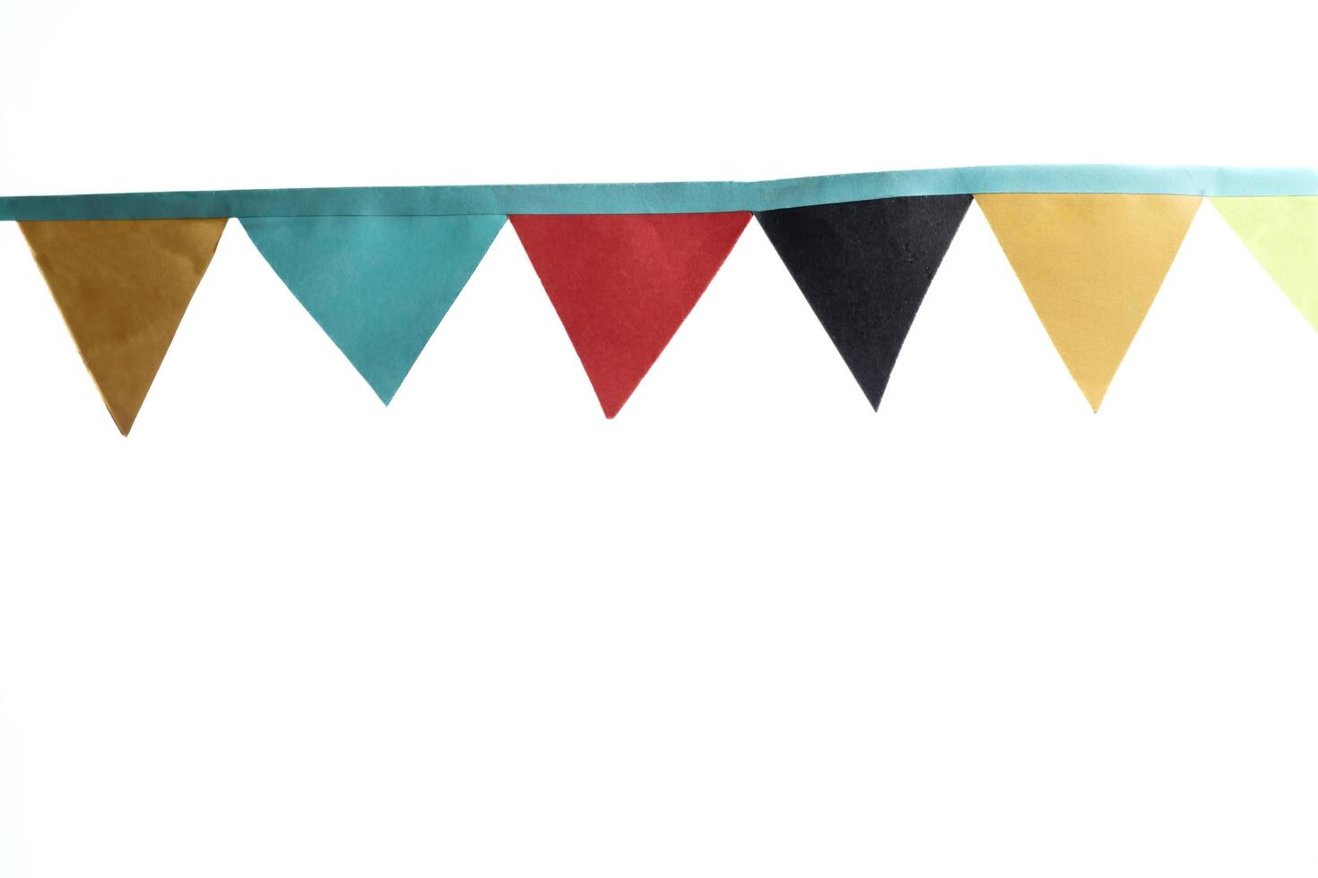 Colorful bunting flags on white background for party and celebration designs photo