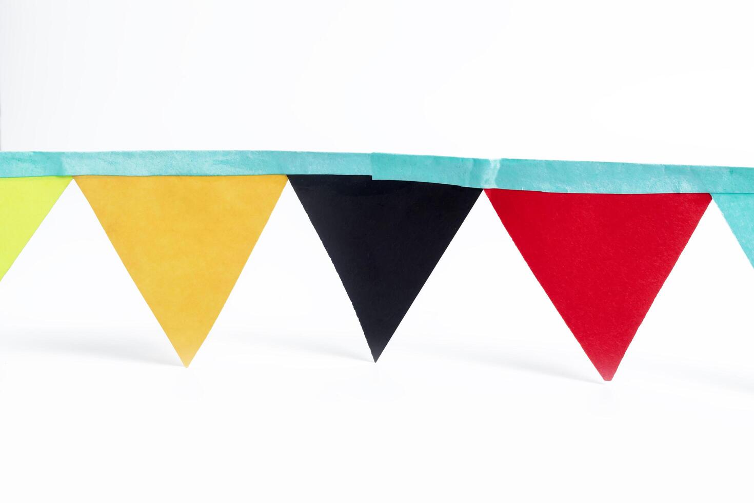 Colorful triangular bunting flags isolated on white background with clipping path photo