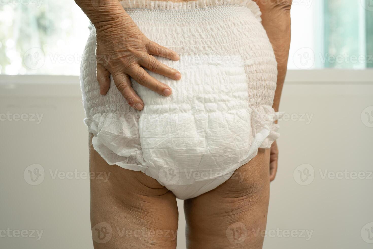 Asian senior woman patient wearing incontinence diaper in hospital, healthy strong medical. photo