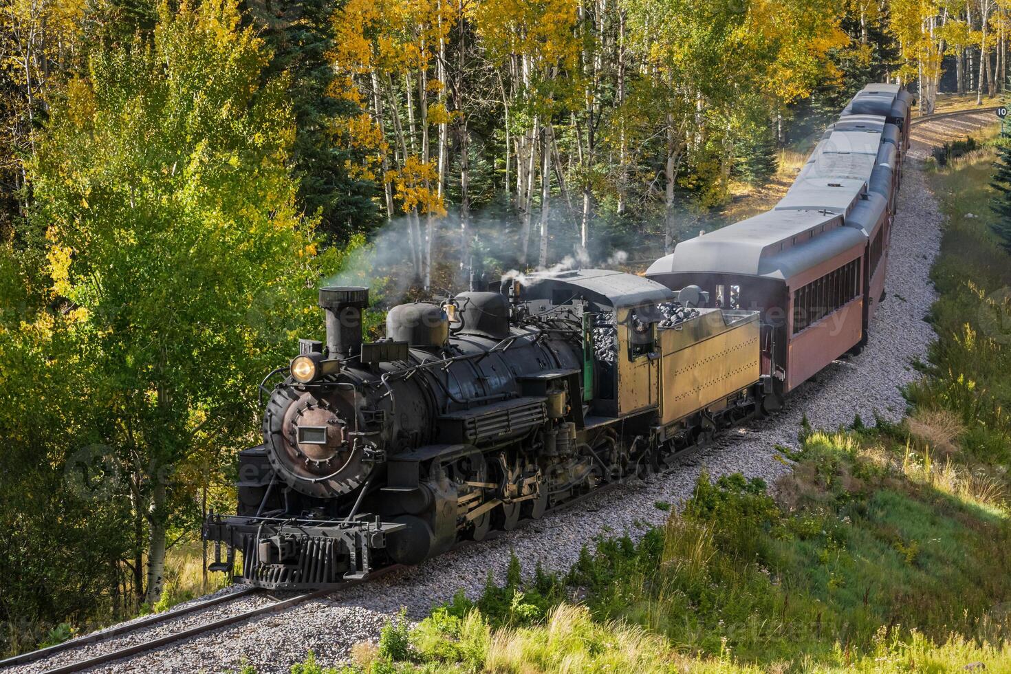 Vintage Steam Train With Autumn Scenery Background. photo