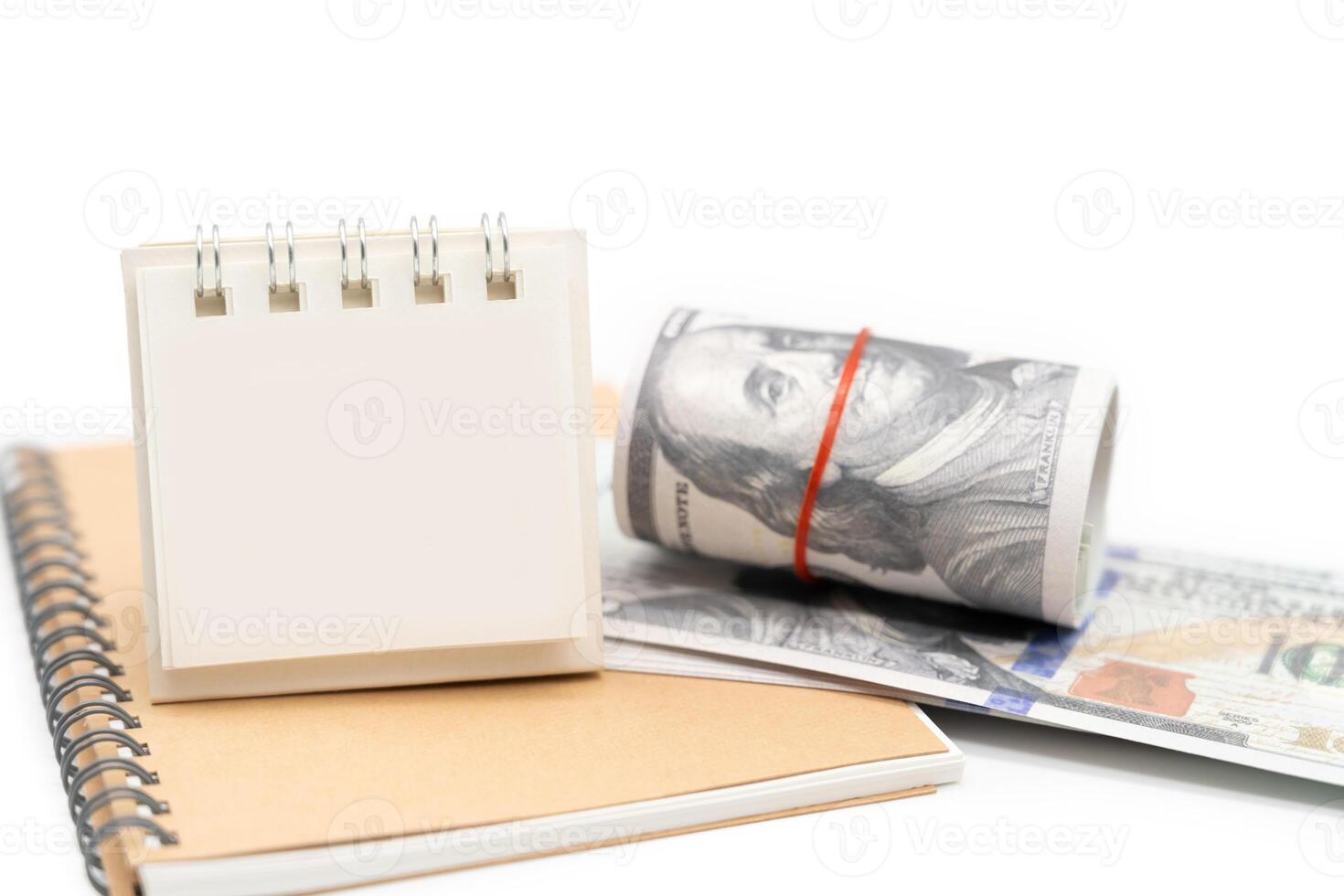 Blank Calendar and US Dollar isolated on white background with copy space. Financial crisis, poverty, lack of money concept. photo