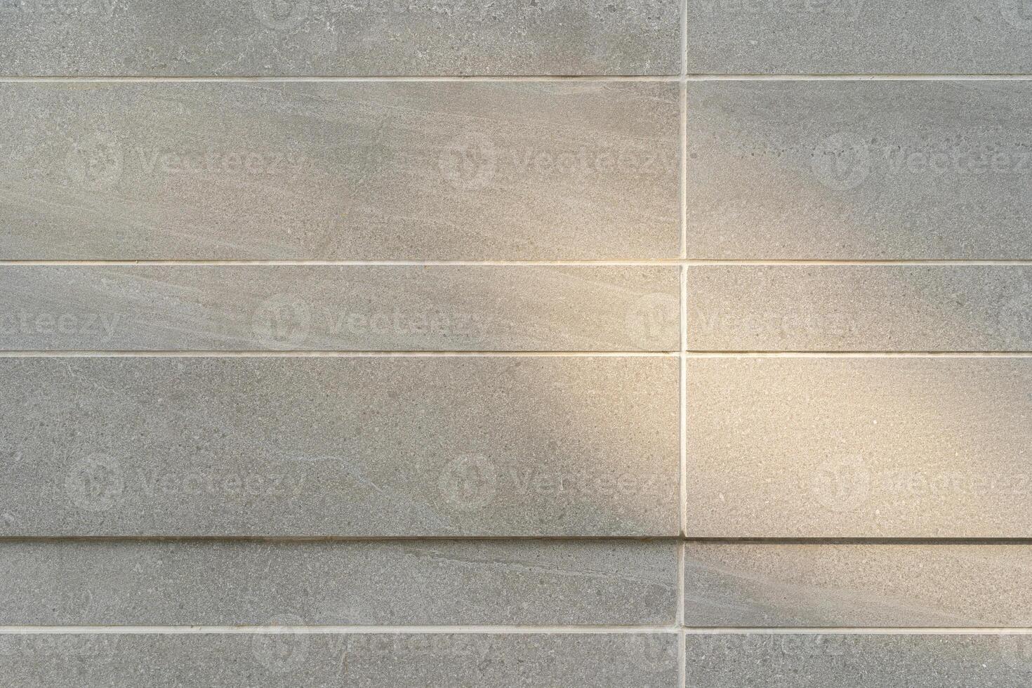 Tile wall for background, marble tile wall pattern with sunlight, for Interiors design. copy space for text. photo