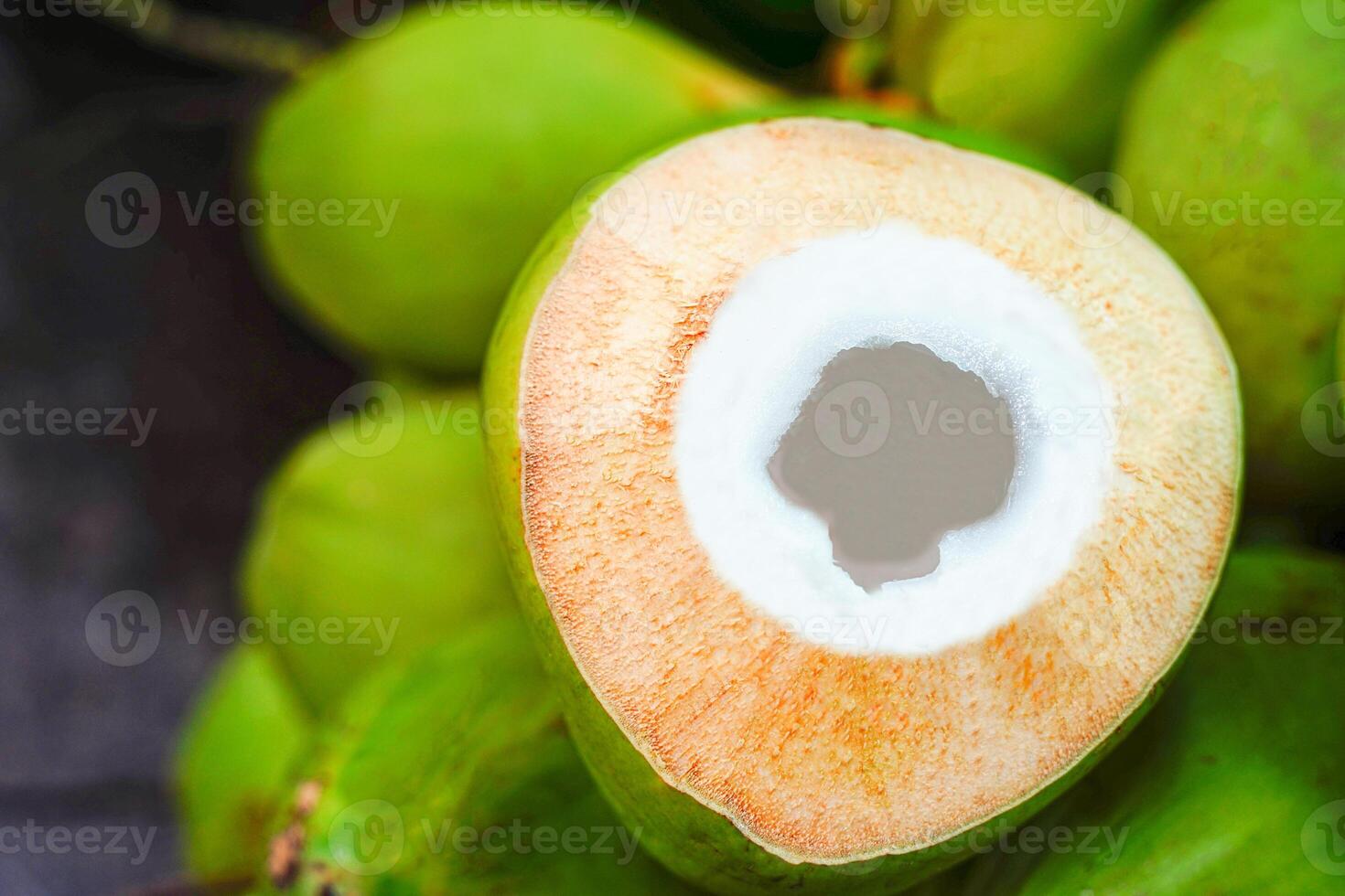 top view delicious fresh coconuts with leaves on background. photo