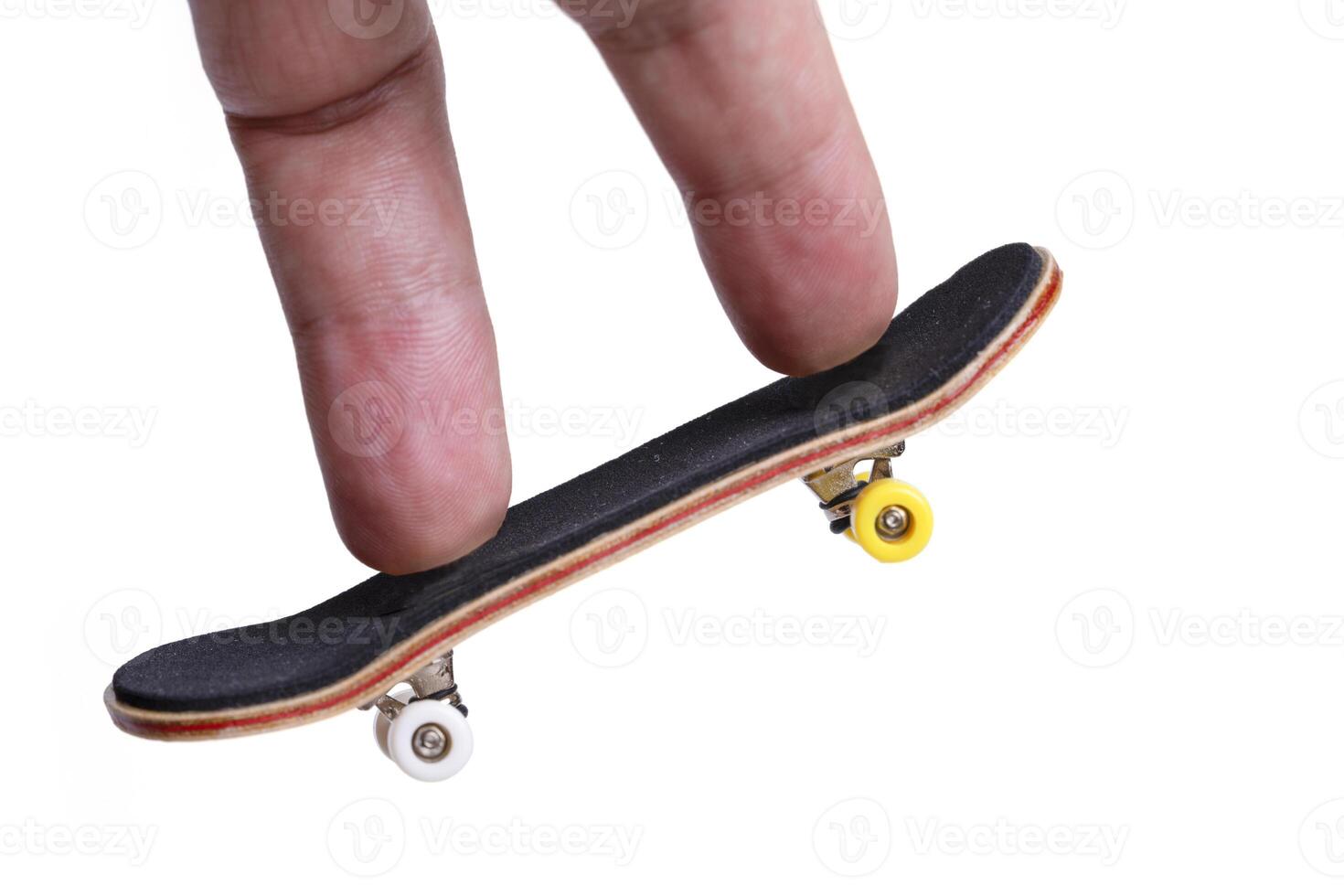 Man playing fingerboard on white background. photo