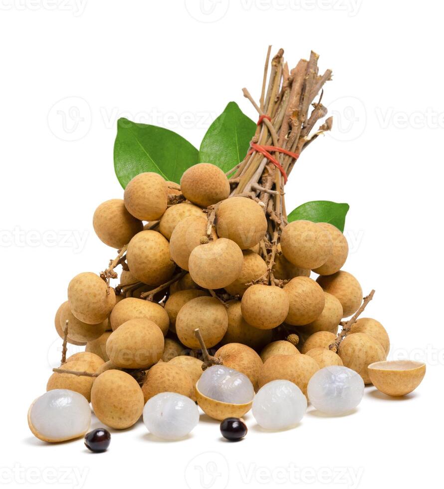 Isolated group fresh longan fruit with leaves and seed on white background. photo