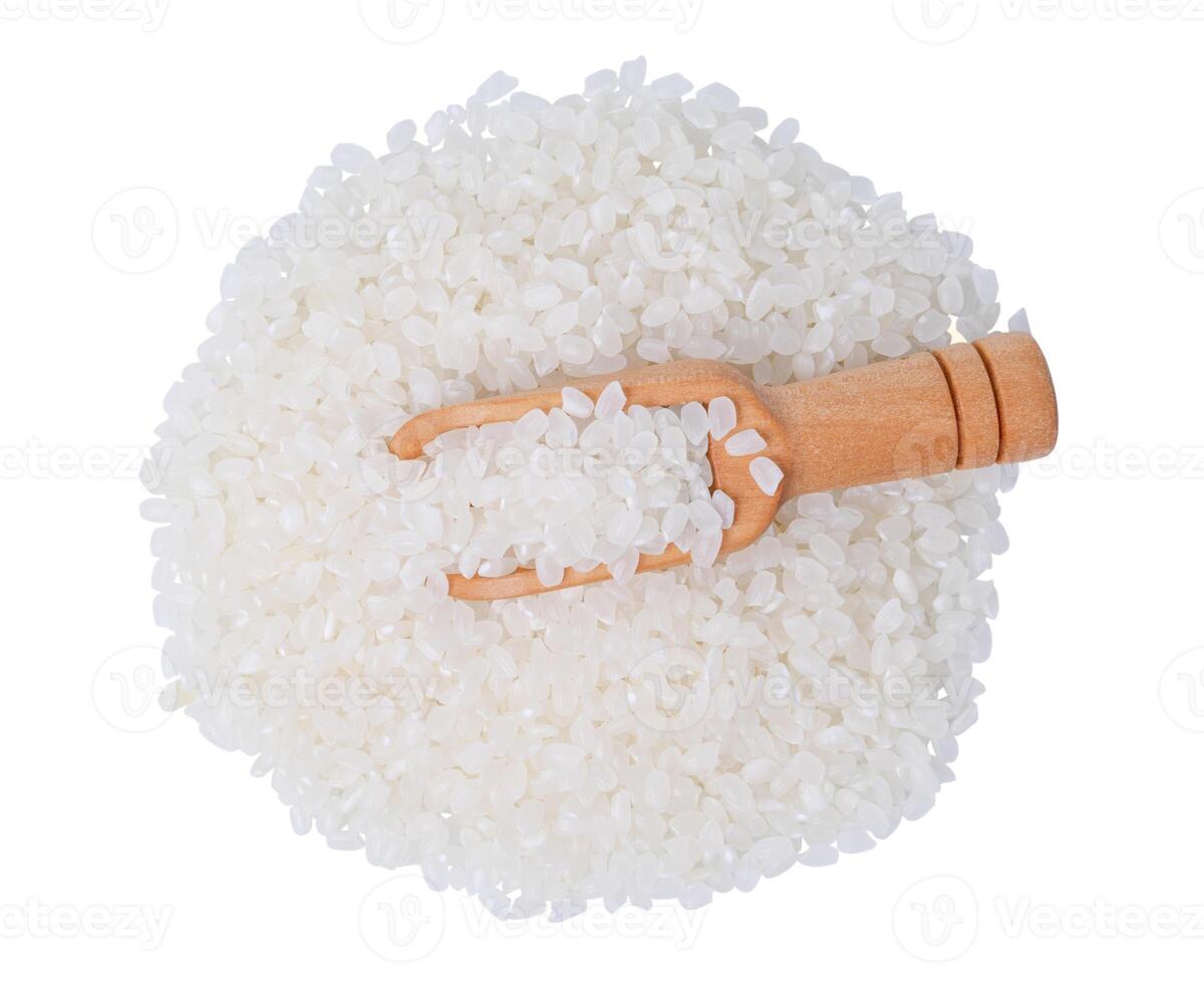 Raw rice japanese in wooden scoop on white background. photo