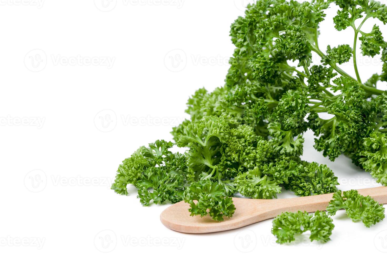 Fresh chopped parsley leaves on white background. photo