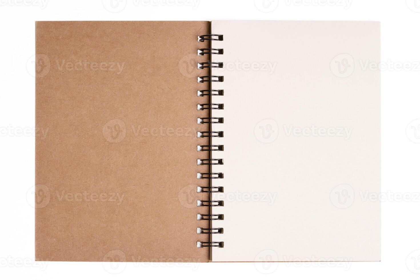 Top view of spiral kraft notebook on white background. photo