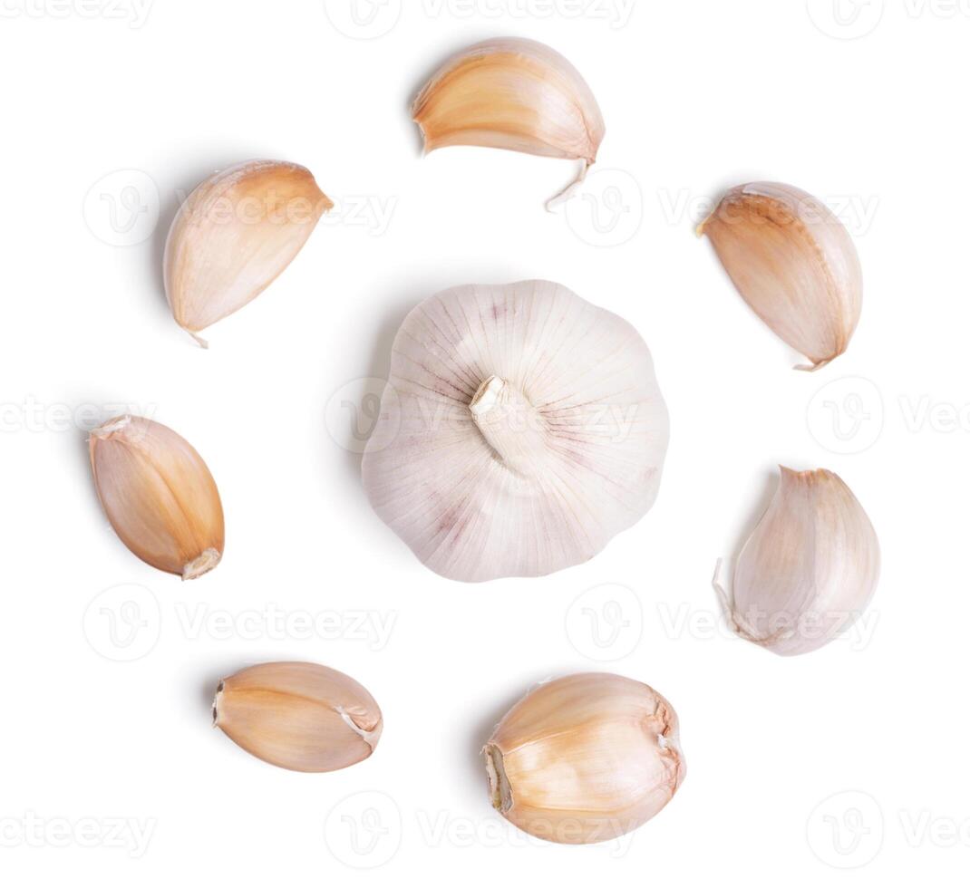 Top view fresh peeled garlic cloves on white background. photo