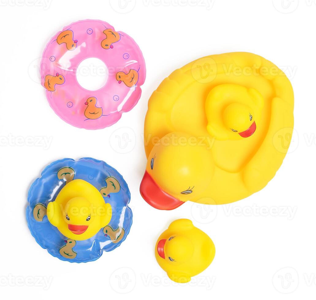 Top view collection of yellow rubber ducks family on white Background. photo