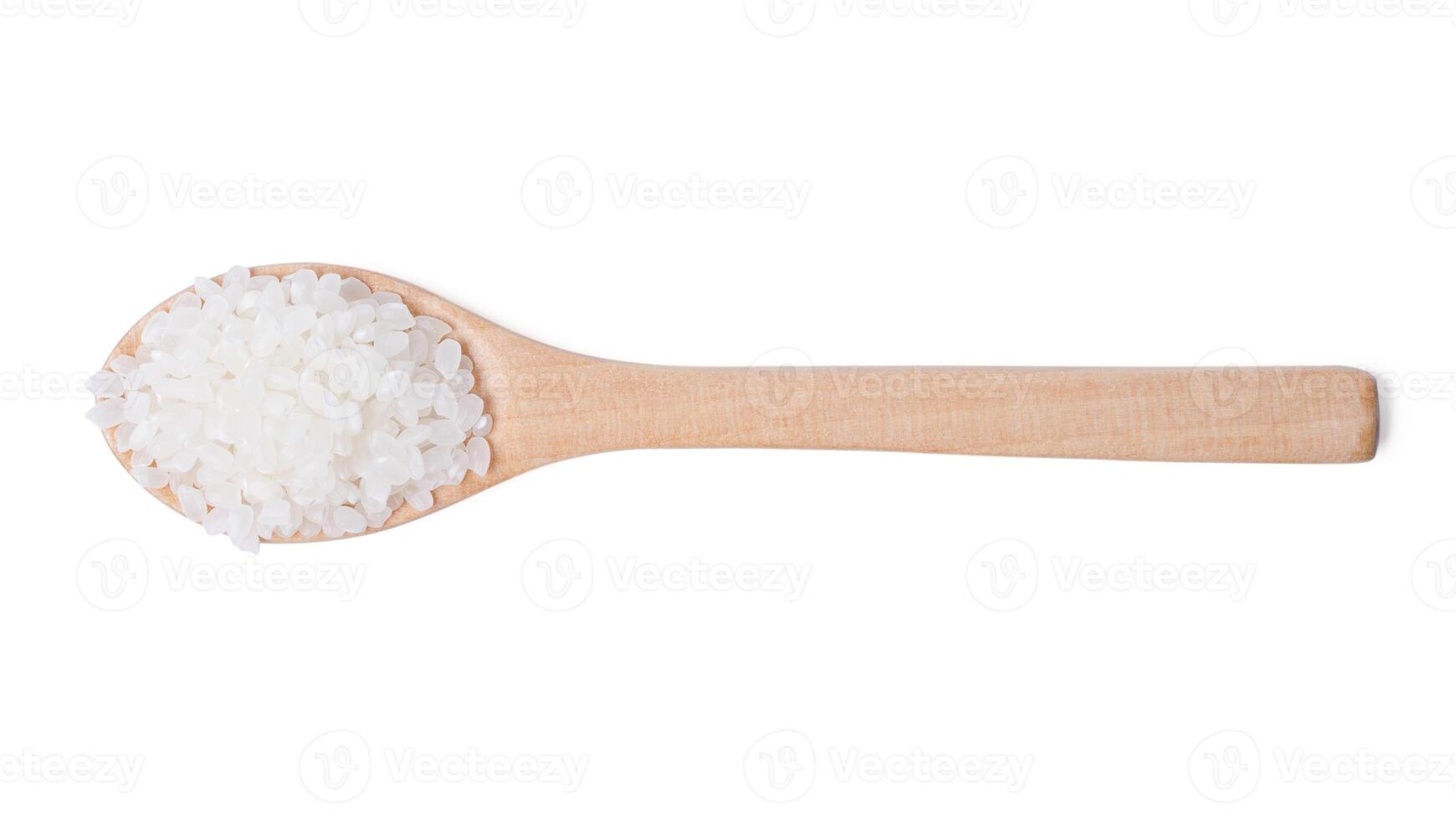 Raw rice japanese in wooden spoon on white background. photo