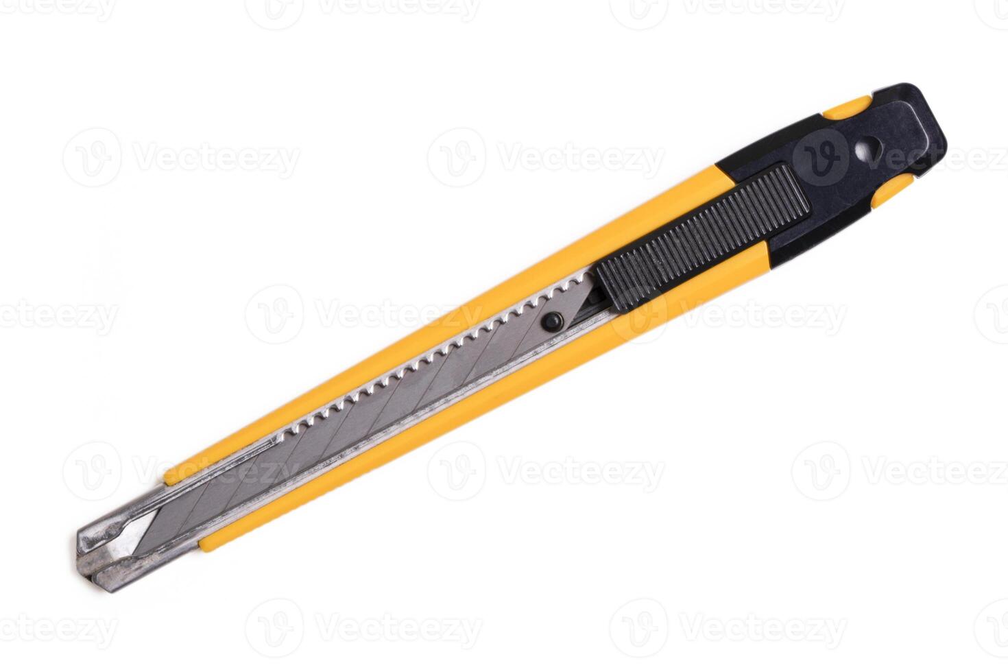 Yellow cutter knife on white background. photo