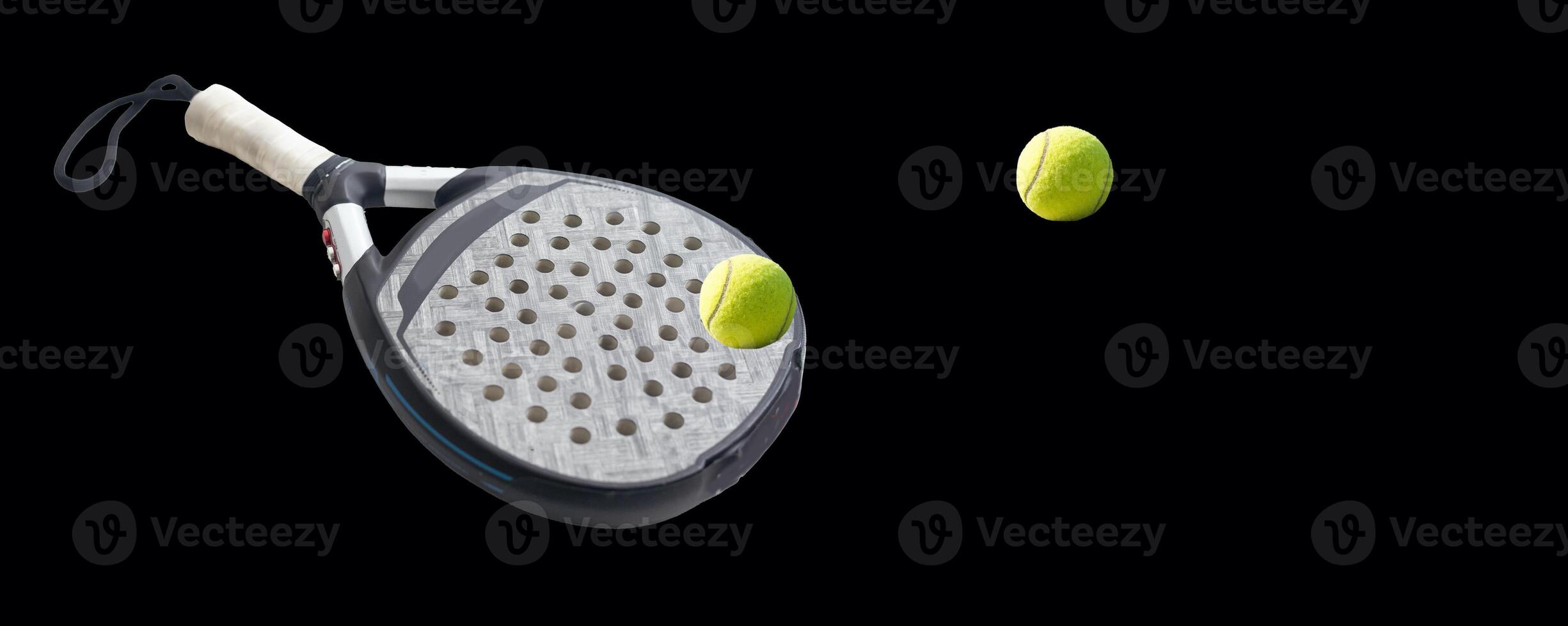 Detailed background of black and white padel racket and ball on black background. Top view. photo