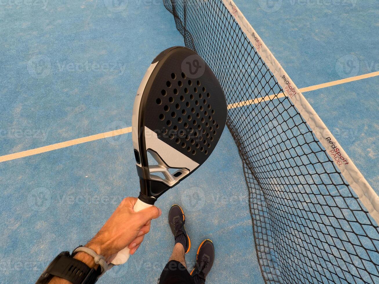 paddle tennis player, hands and racket ready for serve photo