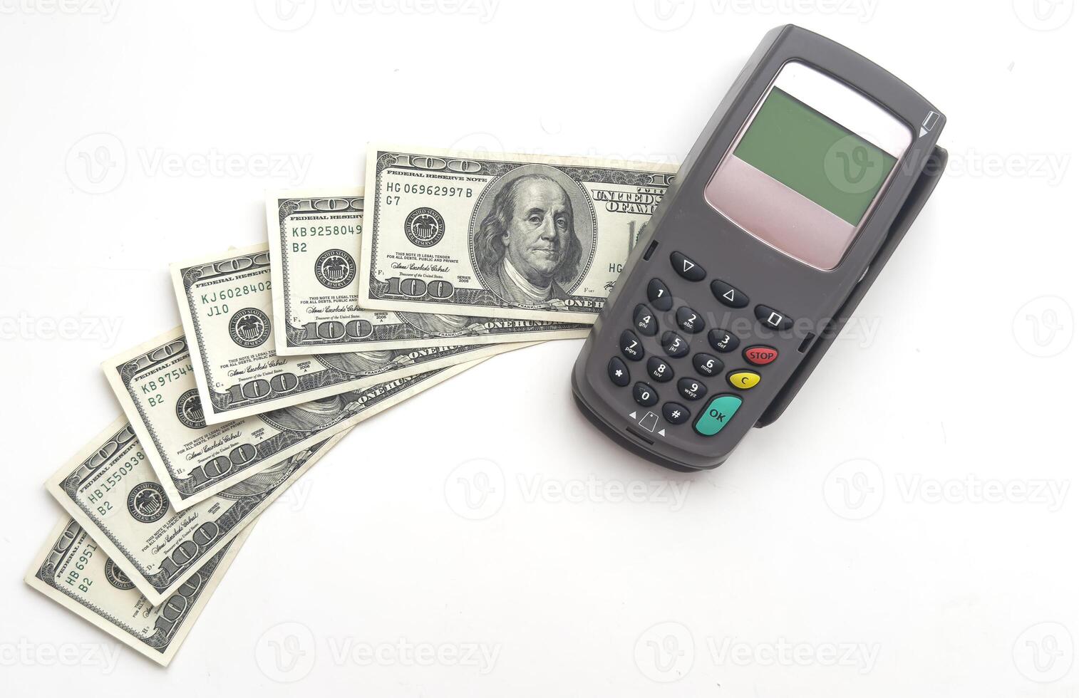 pos wireless terminal dollars cash banknotes isolated on background photo