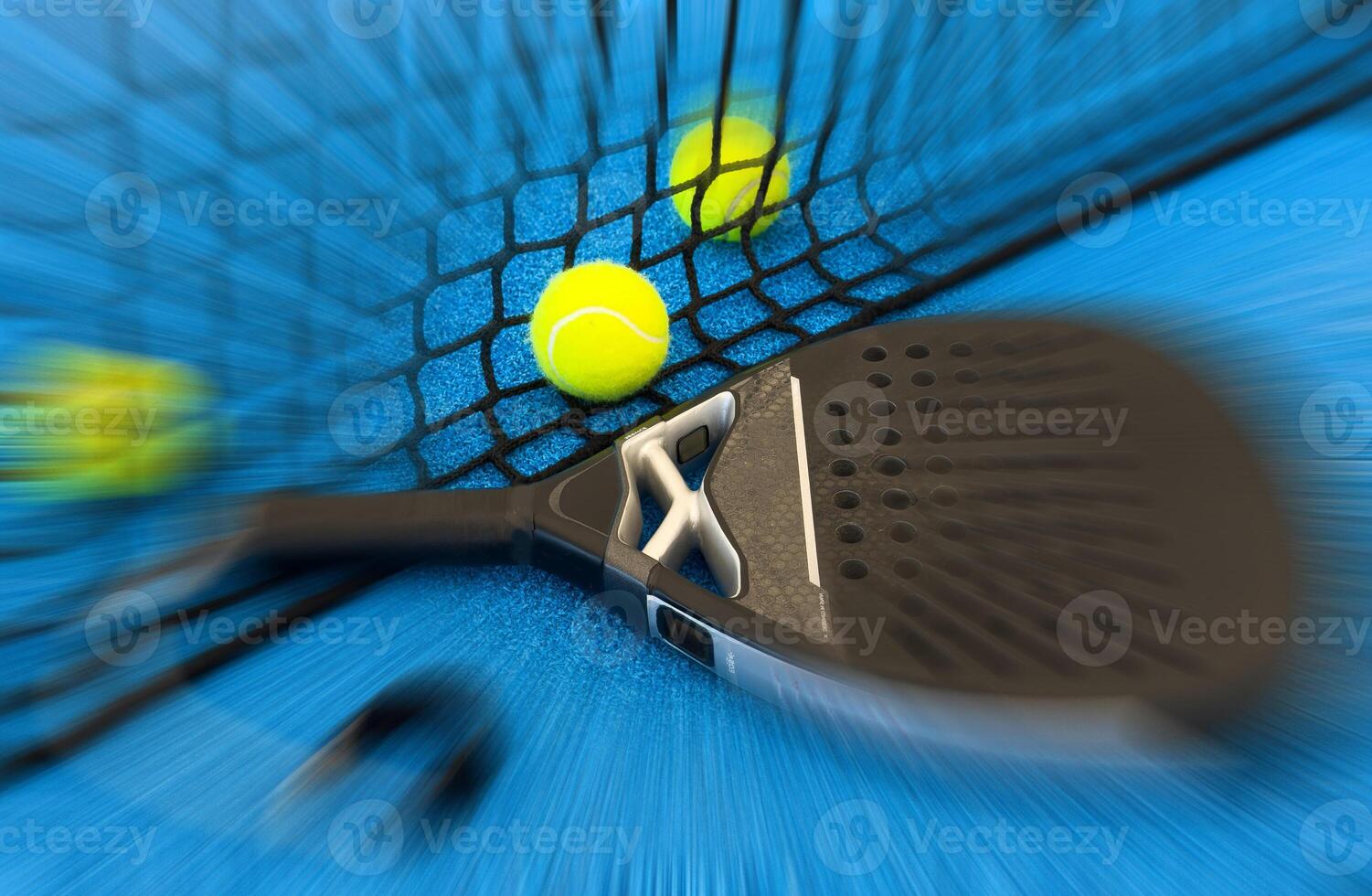 Black professional paddle tennis racket and ball with natural lighting on blue background. Horizontal sport theme poster, greeting cards, headers, website and app photo