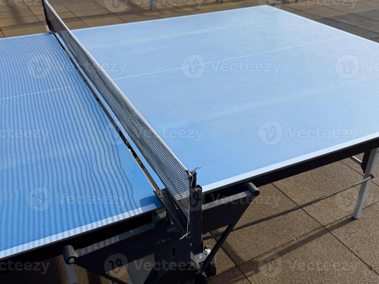 ping-pong table with a net photo