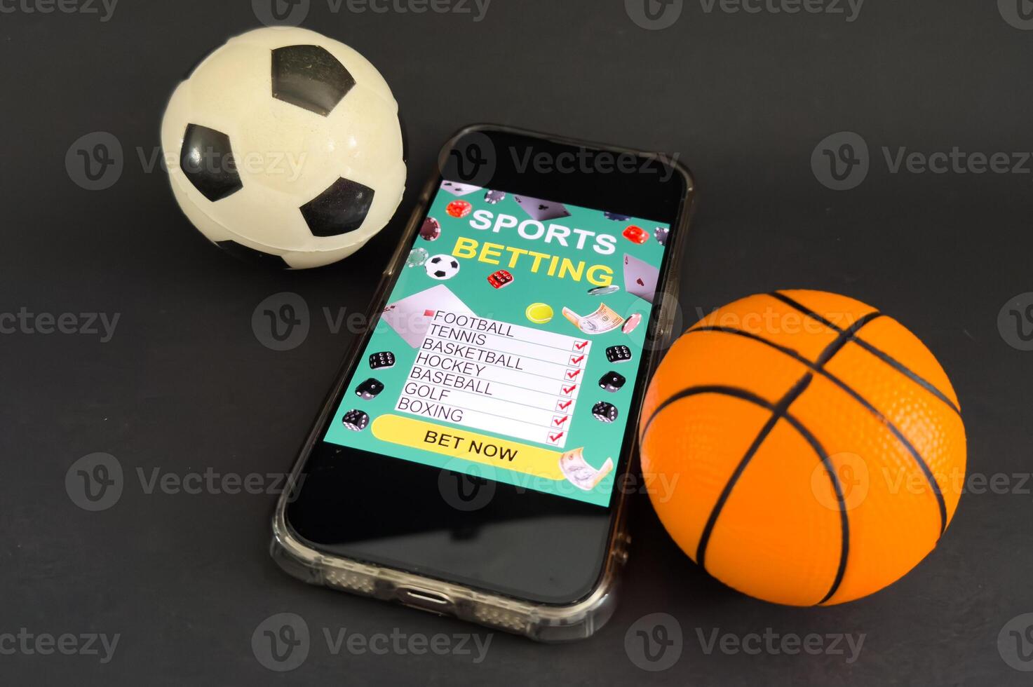 Smartphone with gambling mobile application and soccer ball close-up. Sport and betting concept photo