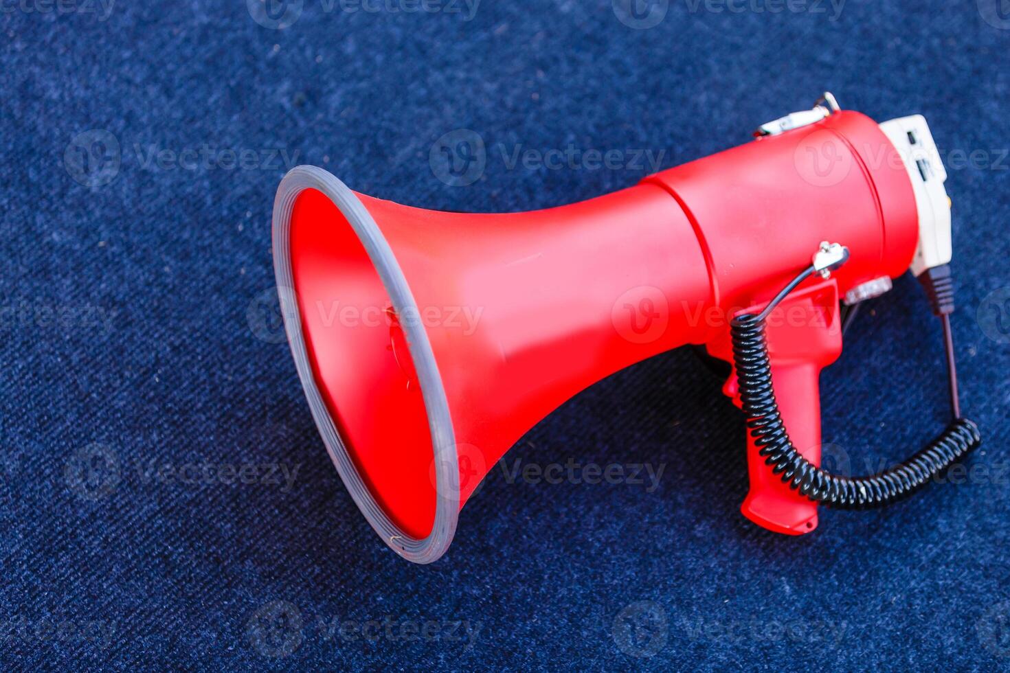 Megaphone on a blue background. Copy space. photo