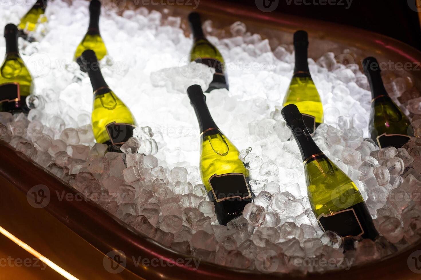 bottles of sparkling wine in ice photo