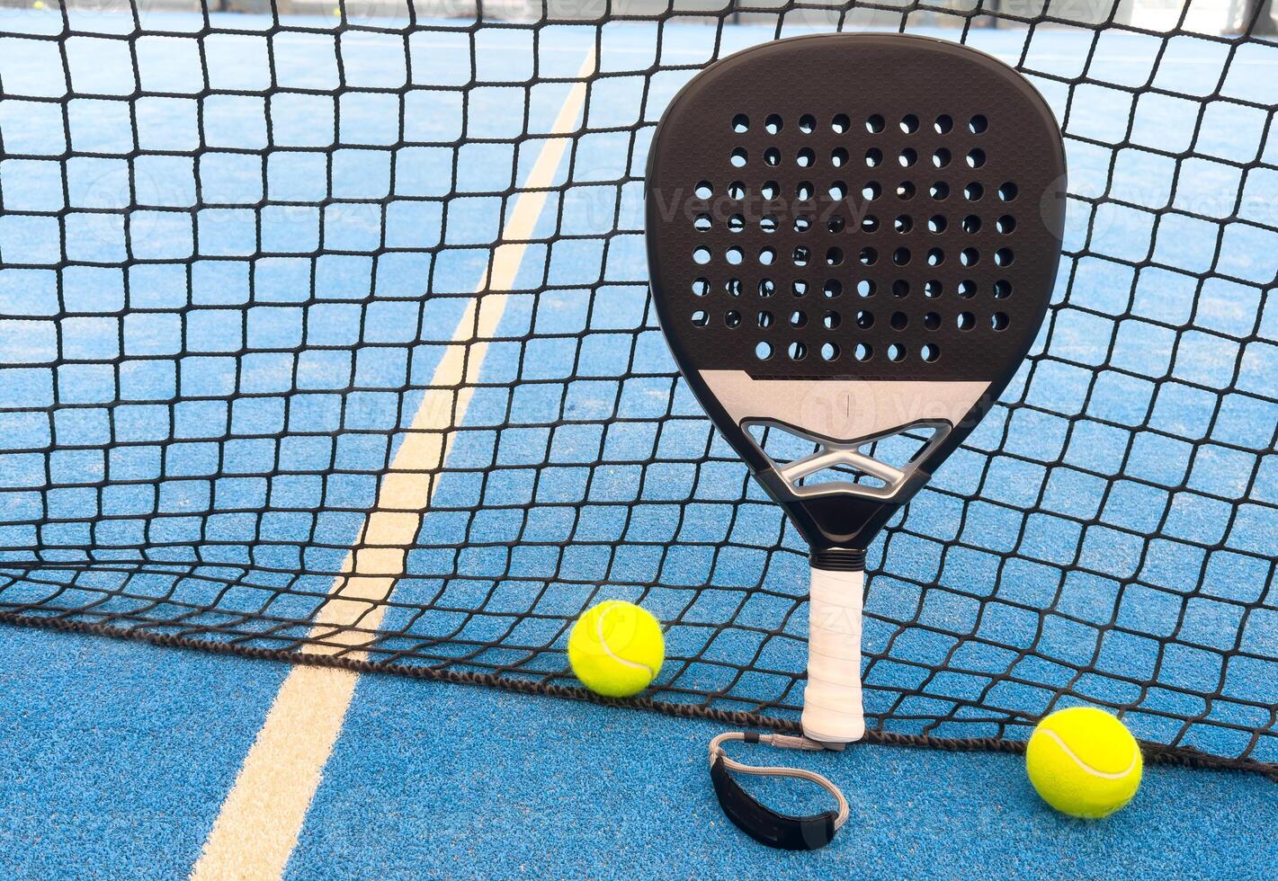 Paddle tennis racket and ball photo