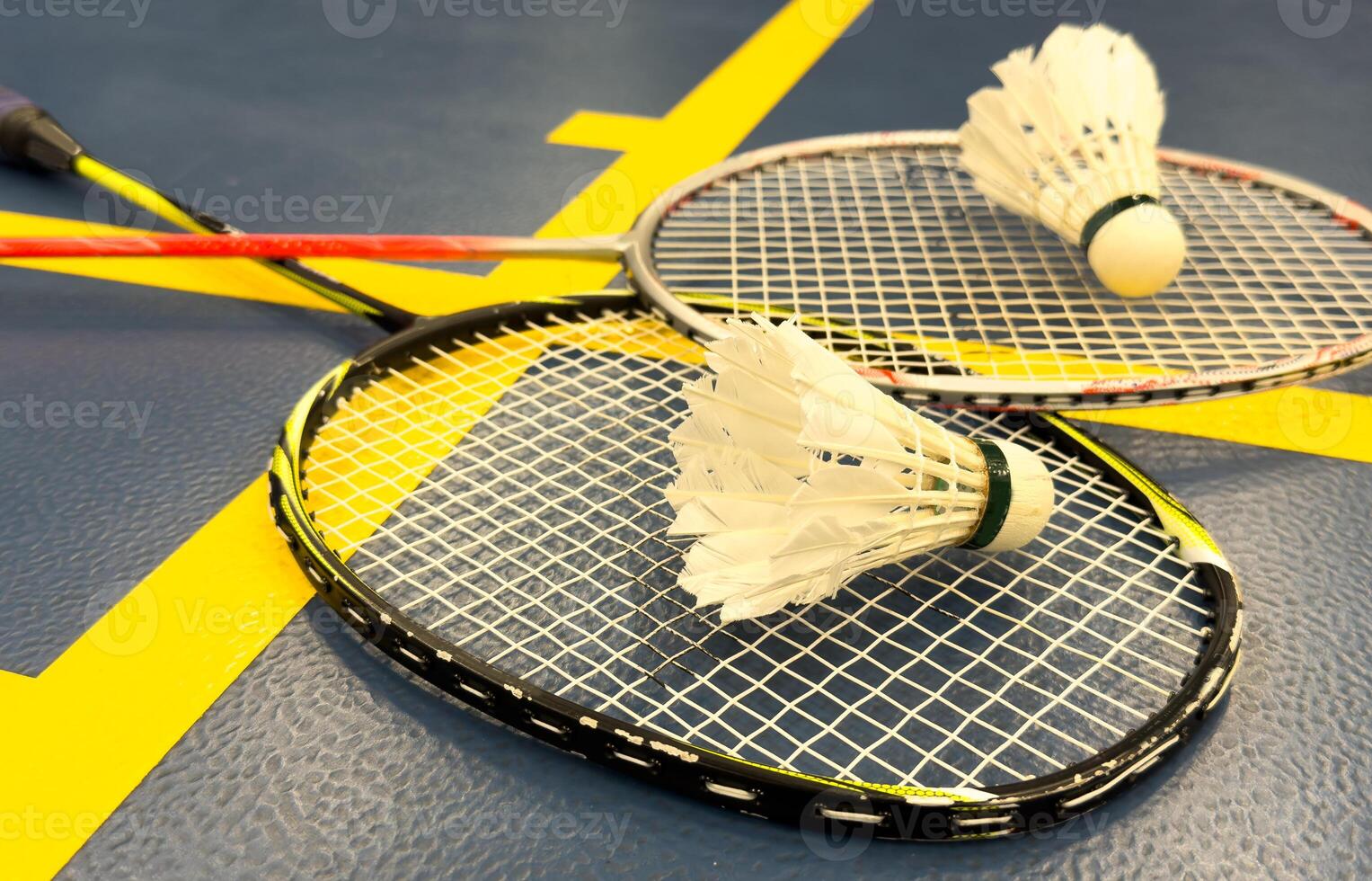 Competitive sports and high performance in tournament match conceptual idea with badminton rackets and shuttlecock with copy space photo
