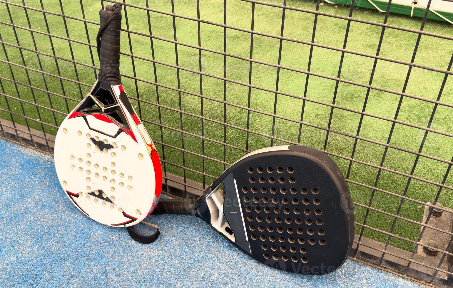 professional paddle tennis racket with natural lighting on court background. Horizontal sport theme poster, greeting cards, headers, website and app photo