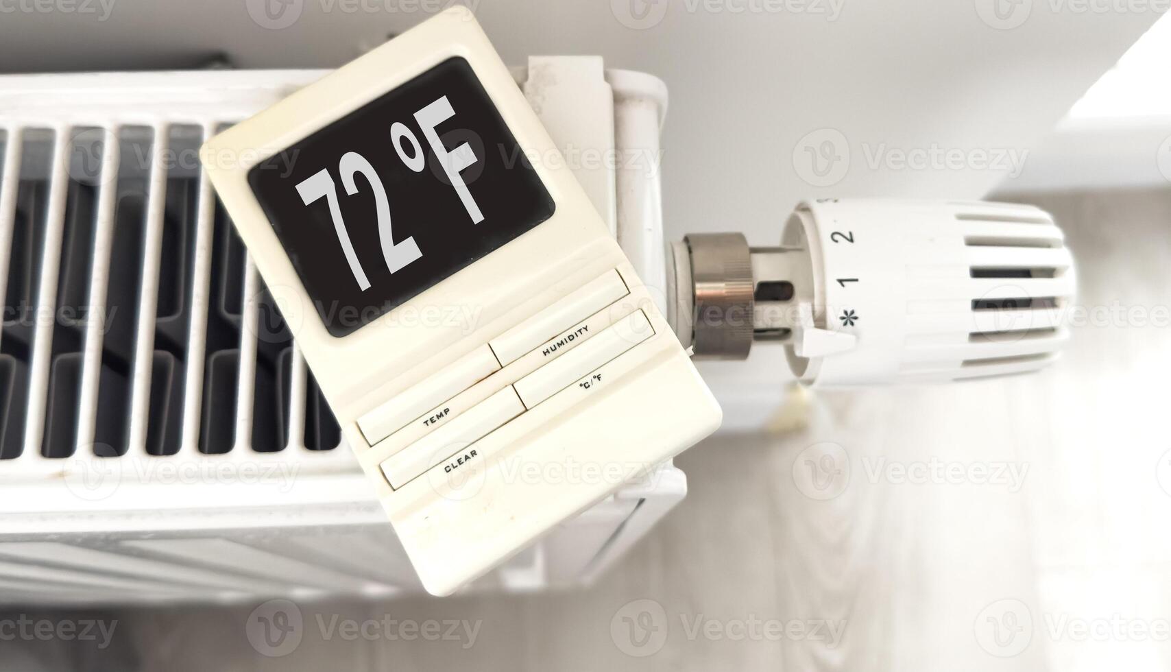 White heating battery and electronic, smart temperature regulator. warmth in the room and the house. preparation for spring and winter. energy saving photo