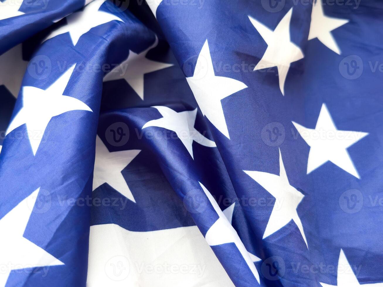 close up of white stars on blue background from the American stars and Stripes flag photo