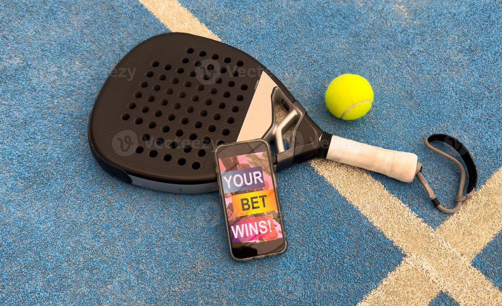 padel tennis and sports betting on a smartphone. Concept of sports bet photo
