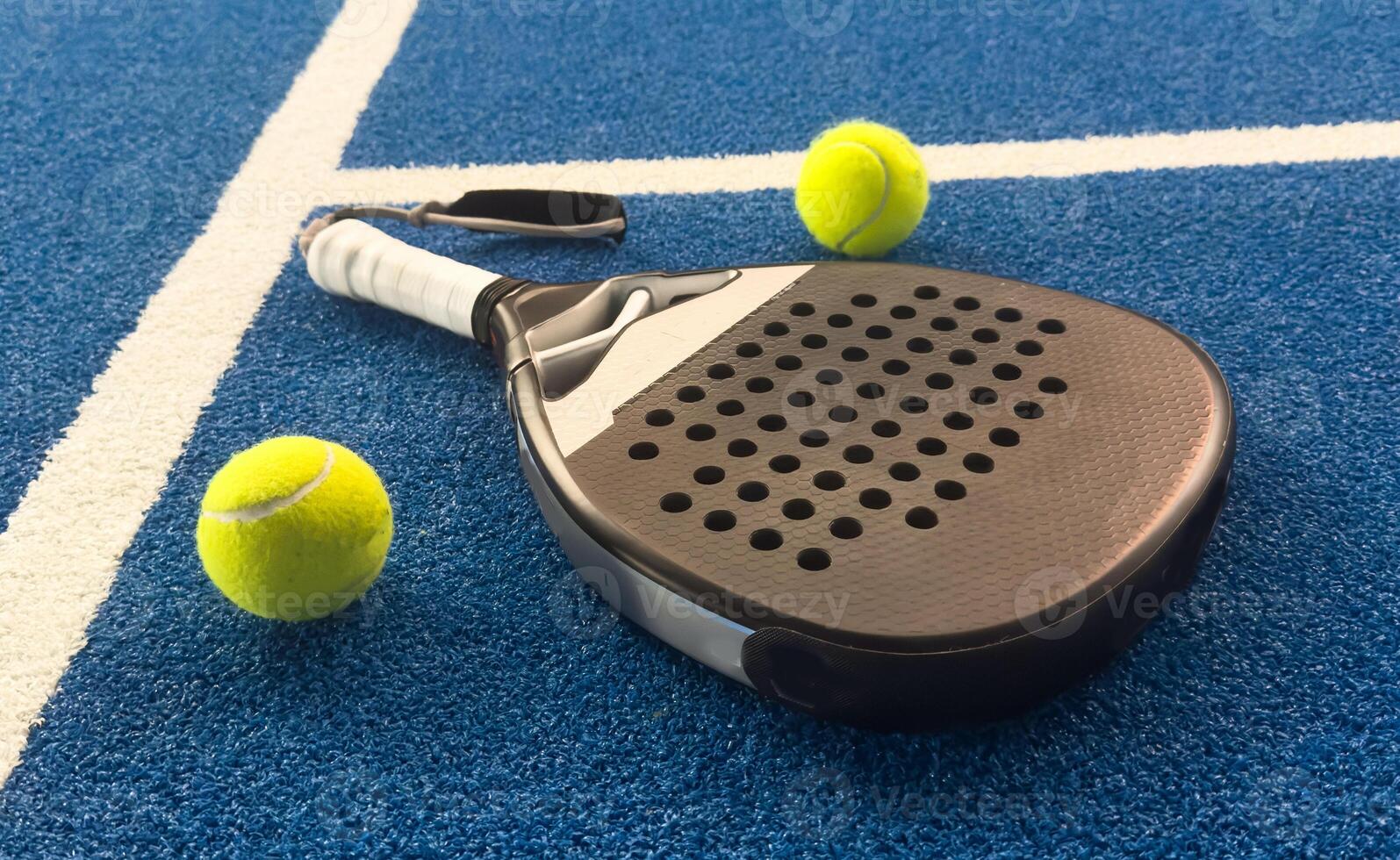 Paddle objects on blue turf photo