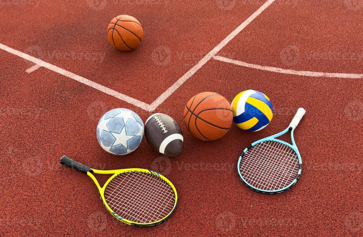 Many different sports balls on green grass, flat lay. Space for text photo