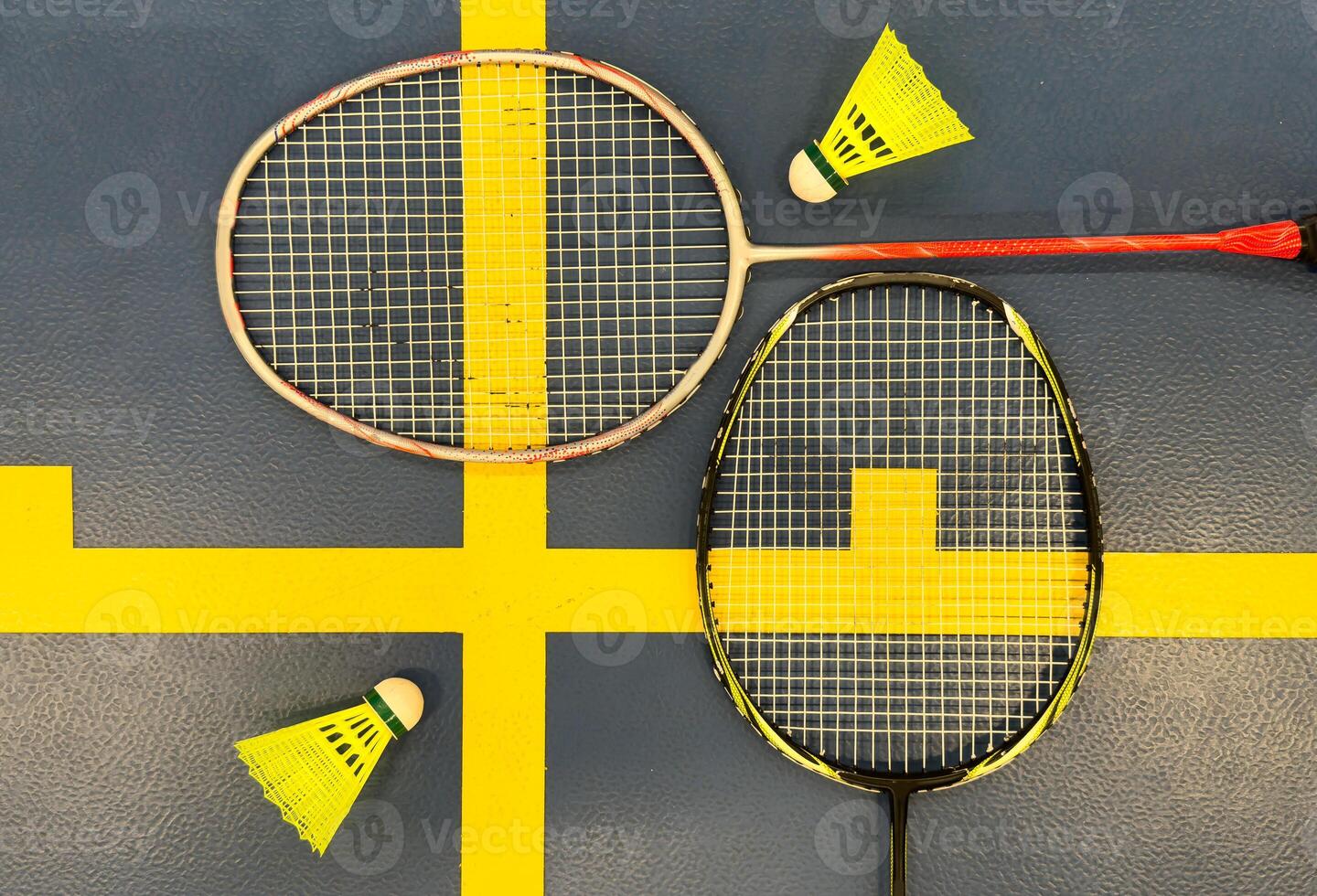 shuttlecock and badminton racket on the court photo