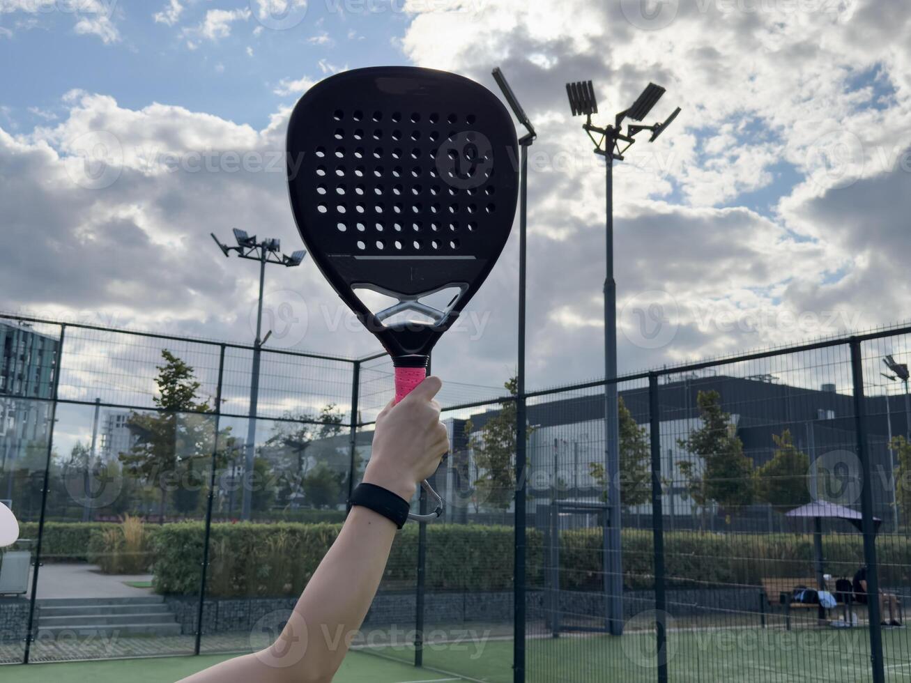 Paddle tennis player racket and ball ready for serve close up anonymous image photo