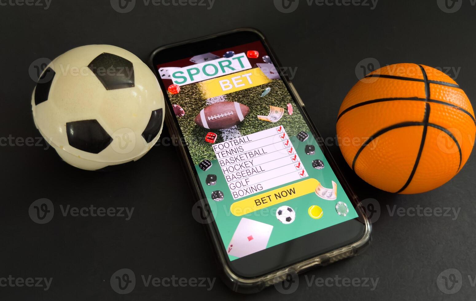 Smartphone with gambling mobile application and soccer ball close-up. Sport and betting concept photo