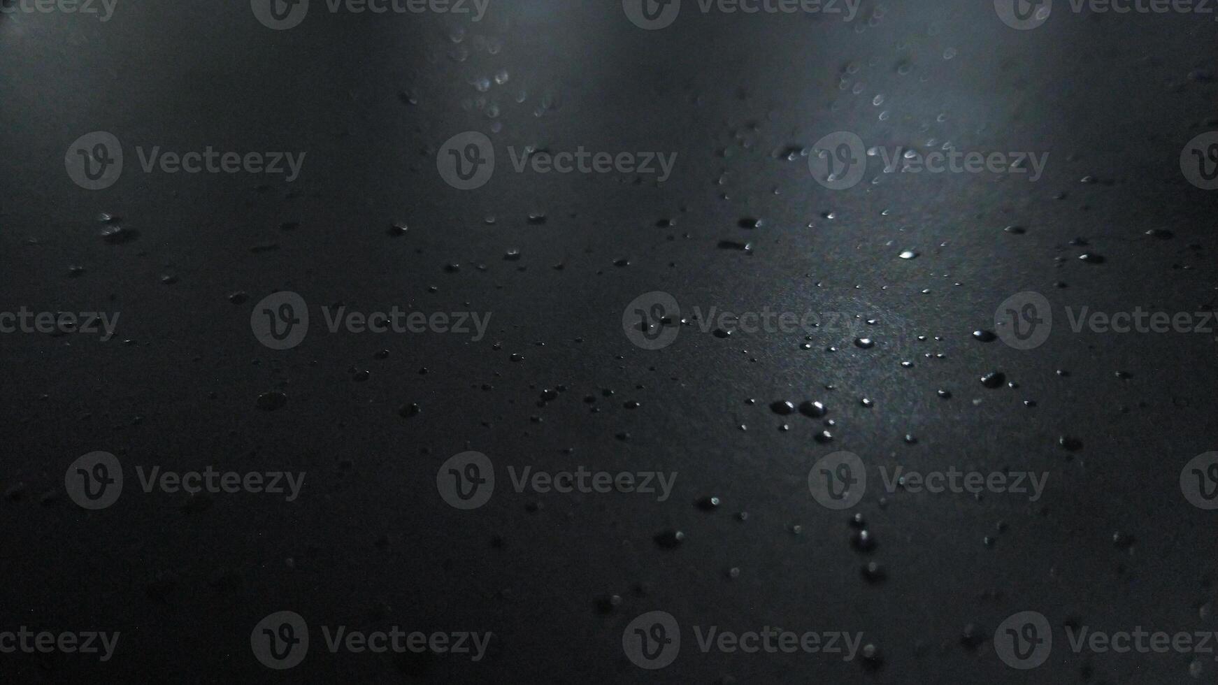 Abstract Dark Surface with Water Droplets photo