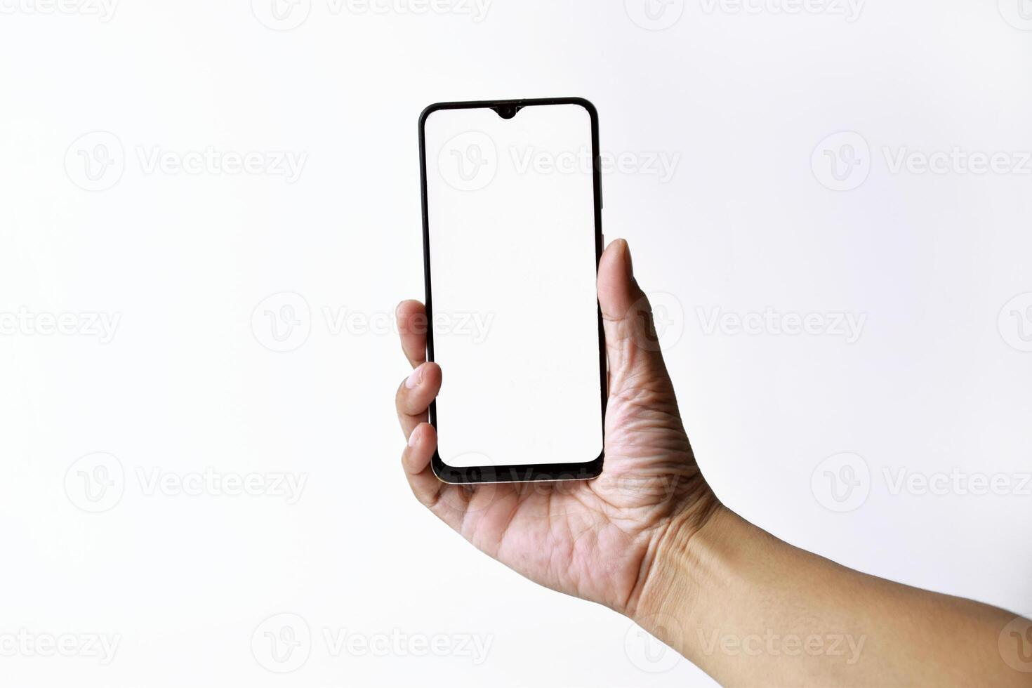 Male hand shows the screen of a mobile smartphone which has a white screen photo