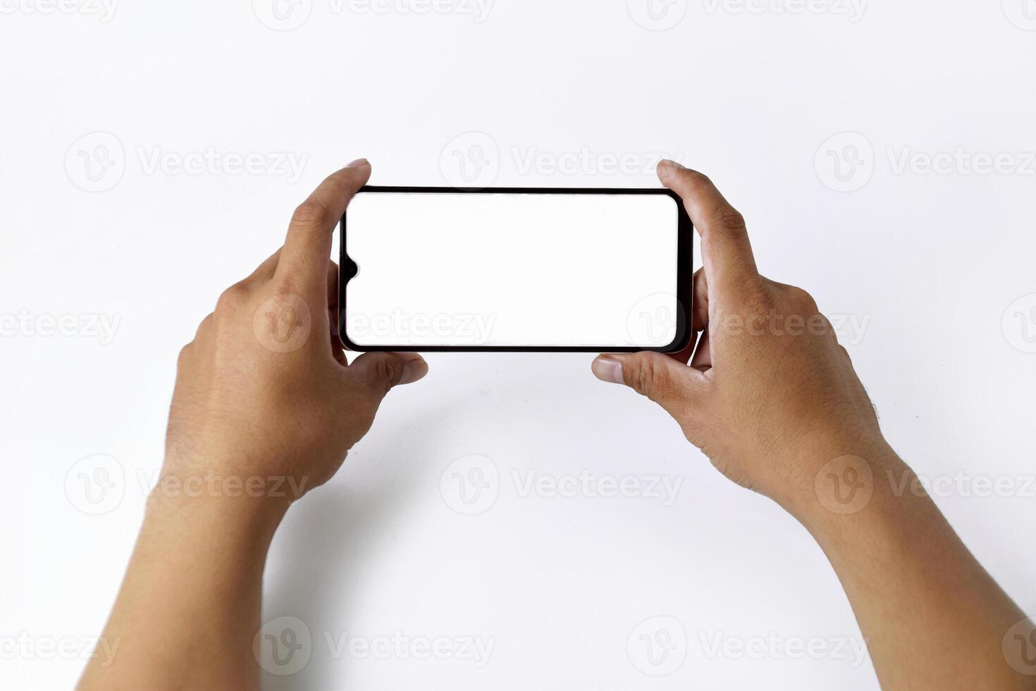 Male hand shows the screen of a mobile smartphone which has a white screen photo
