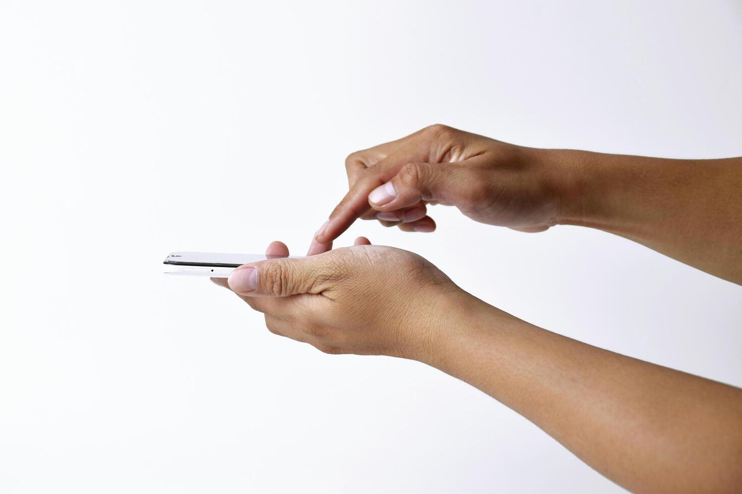 Someone's hand is pressing and pointing at the screen of a smartphone photo