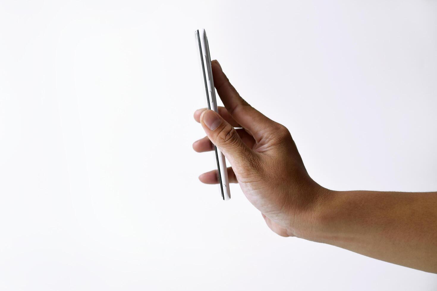 Male hand shows the screen of a smart phone which has a white screen photo